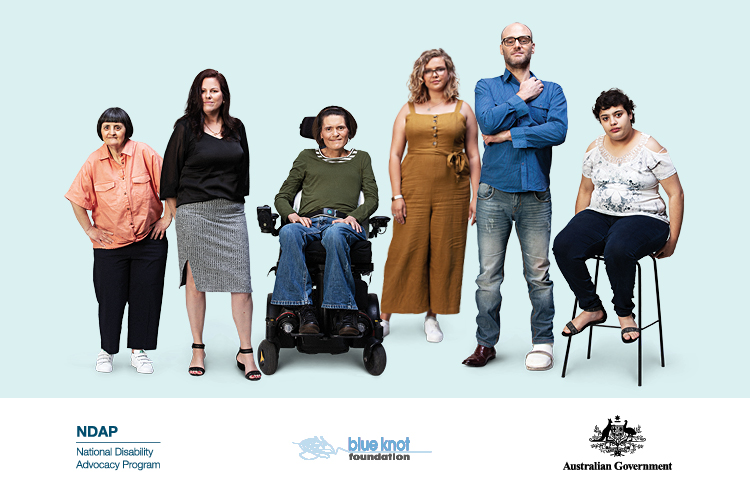 The image shows six people. They have visible and invisible disability. One person is in a wheelchair. One person has a leg brace on their left foot. One person is sitting on a chair. They are positioned in a line. There are three logos at the bottom of the image. The first logo is from the National Disability Advocacy Program. The second logo is from the Blue Knot Foundation. The last logo is for the Australia Government.