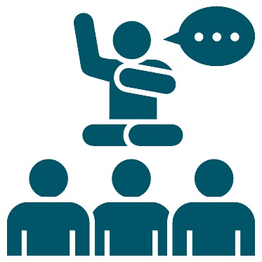 An Elder pointing to themself in front of a group of First Nations people. Next to the Elder is a speech bubble.