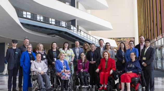 Australian delegates looking at the camera and smiling