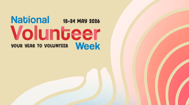 A cream coloured background, with wavy pink, blue, purple and white lines across it. Text reads ‘National Volunteer Week 19-24 May 2026. Your year to volunteer’.