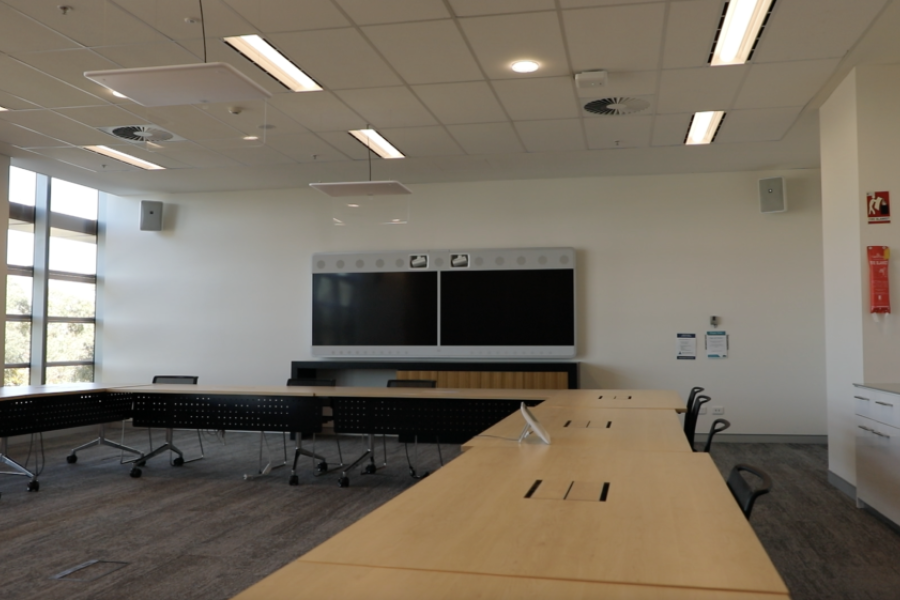 Meeting room with videoconference screens inside Enid Lyons Building.