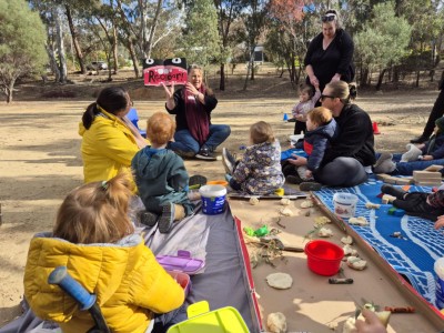 Photo of Amanda running a program in the bush.